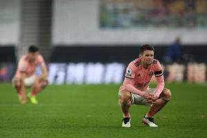 Oli Norwood looks dejected after Sheffield United suffered relegation at Molineux in 2021. (Photo by Geoff Caddick - Pool/Getty Images)