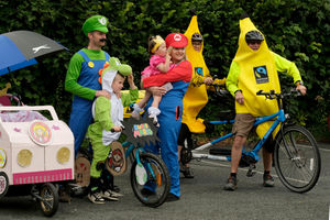 Jess and Giz Morgan with Logan, six, and Evie-Mae, 18 months, as the Super Mario family with Roy and Sandra Williams, dressed as bananas representing the Llandrindod Wells Fairtrade group