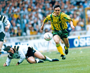 Bernie McNally takes on a Port Vale player