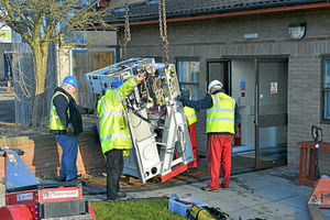 Easy does it  the machine is inched to the ground ready to be manoeuvred into the building