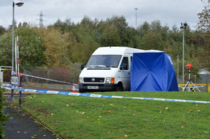 A police tent erected close to a white van at the scene