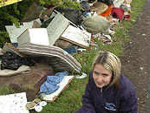 Supporting image for story: Three-piece suite dumped in road