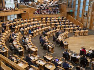 MSPs siting in the Holyrood debating chamber