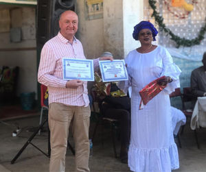 Chris James receiving his honourary father certificate