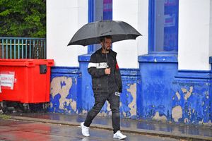 Residents were seen walking around with umbrellas