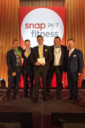 Daniel Smith collecting his Area Manager of the Year