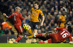 Kevin Foley of Wolverhampton Wanderers is challenged by Raul Meireles of Liverpool and Sotirios Kyrgiakos of Liverpool (AMA)