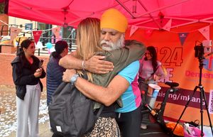 Sarah Chambers from Dementia UK gave Manny a hug after he completed the challenge