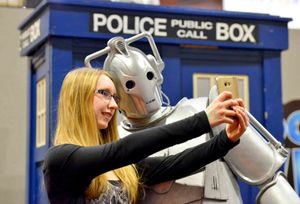 A Cyberman takes a selfie with Alana Temple from Halesowen
