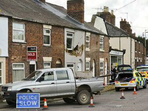 Supporting image for story: Video and pictures: Hole in the wall! Hay falls off trailer damaging front of Ellesmere house