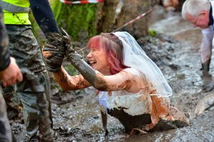 Karen needing to be helped from the muddy depths