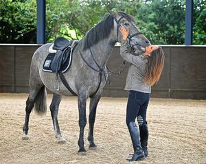 Ever the horse woman, Lisa nuzzles Pele