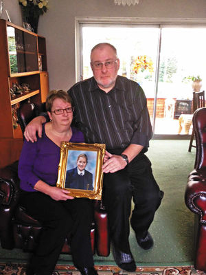 Caroline and Tony Mislolek, with a photograph of their duaghter Nicole, who died on her 13th birthday in the M40 crash