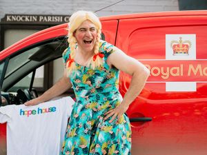 Supporting image for story: Shropshire postie Chris ditches uniform for dress and wig after raising £4,000