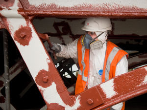 Workmen painted the bridge based on its original colour