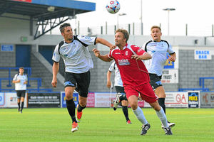 AFC Telfords Andy Owens, left, challenges for the ball with Paul McMullen