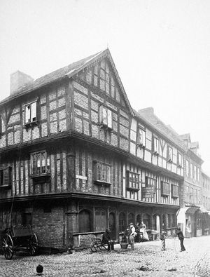 A very early photograph of a distinctive building on the corner of Butcher Row and Fish Street, possibly from the late Victorian era