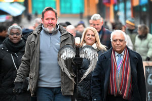 Mark Brindley is pictured with Councillor Ram Mehmi and the torch
