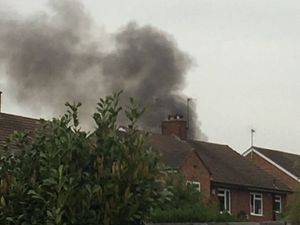 Supporting image for story: Rubbish fire sets garden shed alight