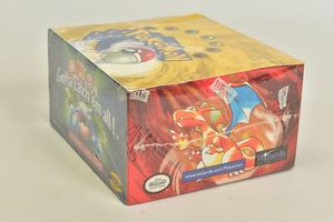This Pokémon Base Set Booster Box from Wizards Of The Coast has never been opened and is still enclosed in cellophane branded with the WOTC rectangular logo.