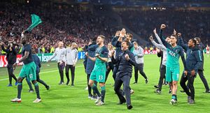 Tottenham Hotspur manager Mauricio Pochettino (centre) and team-mates celebrate after the final whistle
