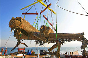 The wreckage of the bomber is raised from the seabed