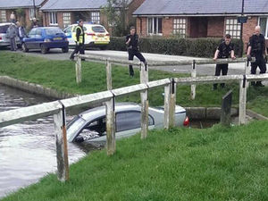 Supporting image for story: Car rolls into canal