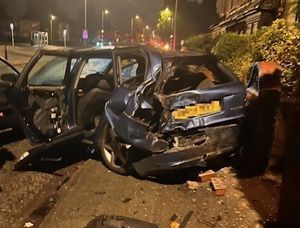 Supporting image for story: Watch: Car ploughs into parked vehicle and wall - and the driver walked away