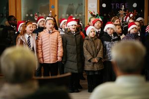 Year Three and Year Four pupils from Lawley Village Academy singing carols for care home residents