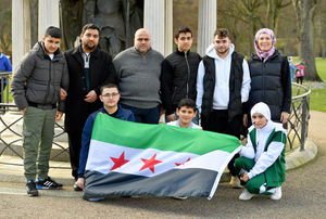Members of the Syrian community gather at the war memorial, at The Quarry, Shrewsbury, to remember the victims of the earthquake..