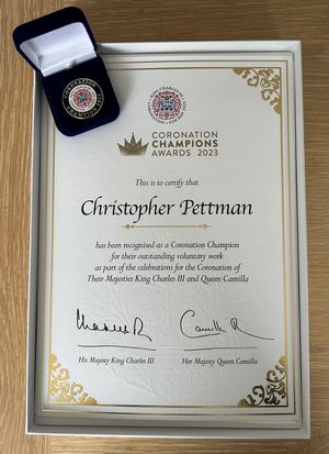Chris Pettman's certificate and badge.