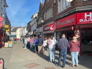 People were queuing down the street.