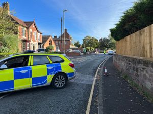 Police examining the scene in Shrewsbury Road, Market Drayton