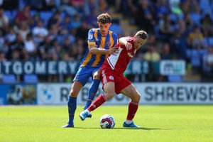 Tom Flanagan of Shrewsbury Town and Shaun Whalley of Accrington Stanley (AMA)
