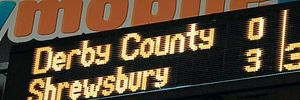 The scoreboard showing Derby County 0-3 Shrewsbury Town after 37 minutes
