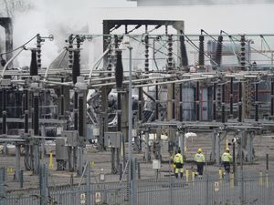 Electricity workers at the North Hyde electrical substation which caught fire