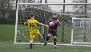 Action from Ellesmere Rangers' (yellow) 3-0 victory at Shrewsbury Up & Comers on Saturday. Dom Smith rushes out to deny Ellesmere's Tommy Clarke