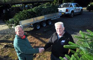 Back in 2014, Morris Bufton & Co provided the trailer to take a Christmas tree to 10 Downing Street – pictured are Colin Griffith of Dinmore Hill Christmas Trees and John Bufton.
