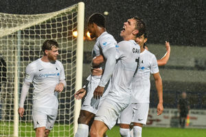 Adan George is given a lift by Oli Cawthorne as his AFC Telford United team-mates rush to mob him after scoring the Bucks' third against Peterborough Sports (Picture: Kieren Griffin Photography)
