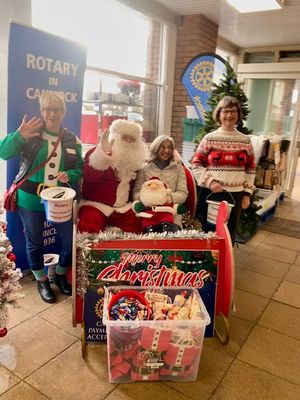 Members of SI Cannock collecting with Santa
