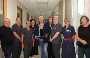 (L) Cyril Barrett and (centre) former Goodyear worker Wayne Devaney with nurses and other staff from New Cross Hospital.