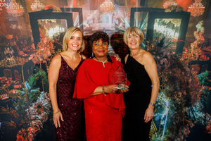 Siobhan Rowland and Hester Maclean of Edwards Wealth present the Excellence In Health & Wellbeing Award to Doreth Abrahams