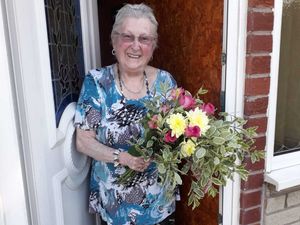 Supporting image for story: Shifnal Covid-19 help group presents flowers to 1,000th caller