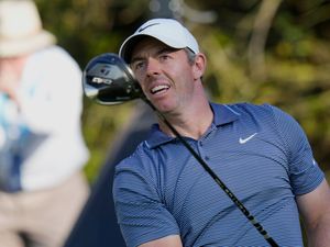 Rory McIlroy watches his tee shot on the 15th hole during his first round of 67 in the Players Championship