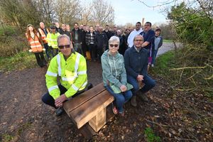 The Telford Town Park bench unveiled as a tribute to former Fujitsu worker and town park volunteer, Christ Nutt. His mother, Christine Nutt was joined by the chair of the Friends of Telford Town Park, Adrian Smith, and Kevin Deane from Fujitsu for the unveiling.