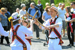 Members of the Stafford Morris Men entertain the crowds in Church Aston in Newport