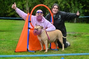 Darren Kenny (left) and his dog Thena, and one of several organisers Ellie Brodie.