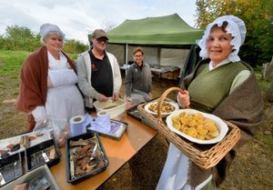 Simon Walker from Shrewsbury, cleaning up finds, with him is Trust Archeologist Viviana Caroli, and Pat Jenks and Bridget Cleave, with some cakes made in the mansion house for diggers, and visitors