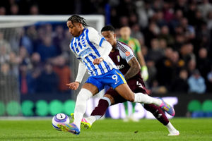 Ezri Konsa battles for the ball during Aston Villa's trip to Brighton