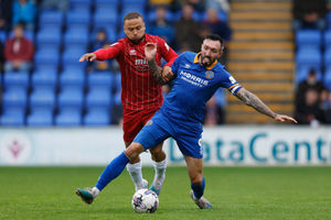 Ryan Bowman of Shrewsbury Town and Curtis Thompson of Cheltenham Town in the opening game of the 2023-24 campaign. (AMA)